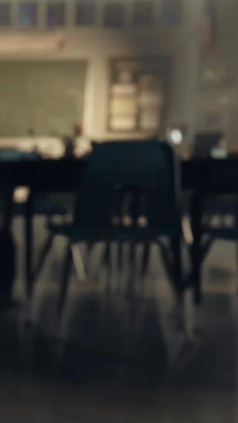 Empty classroom with chairs and tables arranged for learning in afternoon light Stock Footage 335688495