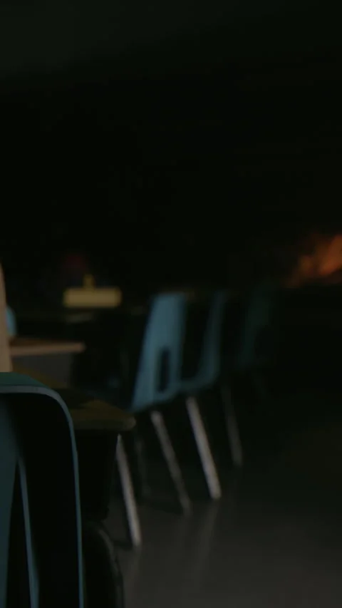 Empty classroom with chairs and tables in low light during evening time Stock Footage 339392981