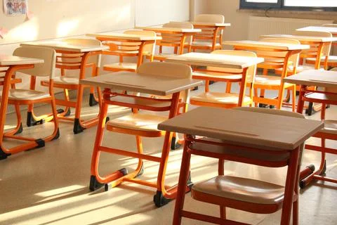 Empty classroom desk without students because of flu Stock Photos