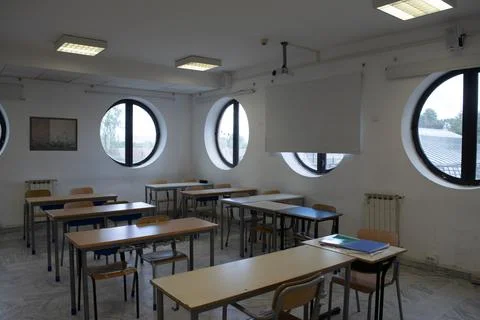 Empty classroom with desks and chairs Stock Photos
