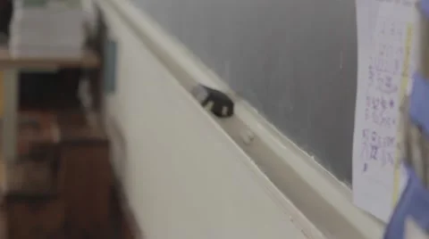 Empty classroom dolly across chalkboard with eraser 動画素材 40853663