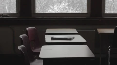 Empty classroom dolly across desks looking out windows Stock-Footage 40857785