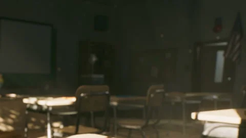 Empty Classroom During the Late Afternoon With Sunlight Streaming Across Desks 스톡 동영상 348403867