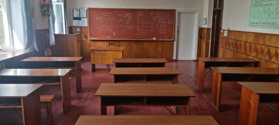Empty Classroom with Math Formulas on Blackboard Фото