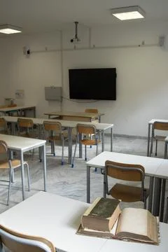 Empty classroom with modern desks and television Stock Photos