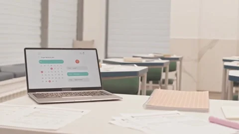 Empty Classroom Scene with Papers, Laptop, and Schedule in Motion Stock Footage 321036280