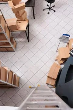 Empty classroom with stacked cardboard boxes Stock Photos