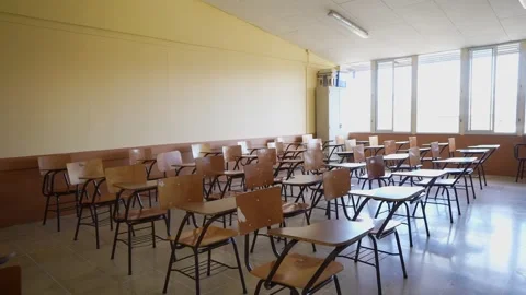 Empty classroom with student desks inside modern educational center Stock Footage 336467771