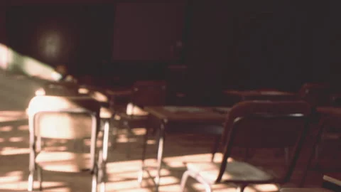 Empty classroom with sunlight entering through windows in the afternoon Stock Footage 344287773