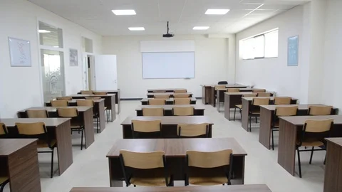 Empty classroom at University. Lecture room. Classroom furniture in college Stock Footage 121510612
