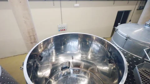 Empty clean barrels for wine production process, top view shot of cylinder tanks Video stock 306773814
