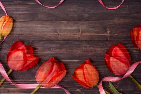 Empty clean black chalkboard with red tulips. Top view Stock Photos