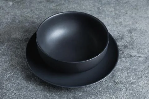 Empty clean ceramic dishware on grey table, closeup Stock Photos