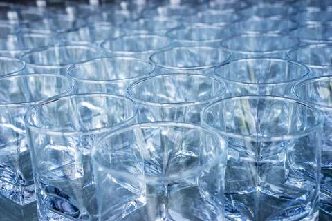 Empty clean glasses are on the table. Preparing dishes for serving Stock Photos
