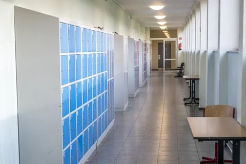 Empty clean hallway corridor classroom with colored furniture lockers and doo Fotos Stock