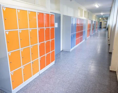 Empty clean hallway corridor classroom with colored furniture lockers and doo Fotos Stock