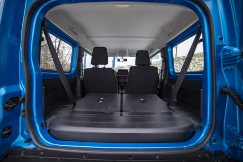 Empty clean trunk with seats folded into flat flor of suv crossover Stock Photos