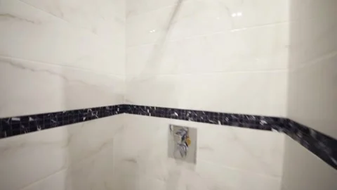 Empty, clean, white bathroom with shower, toilet in apartment Stock Footage 276364421