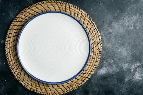 Empty clean white plate on gray stone background. Gray minimalism concept. Copy Stock Photos