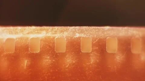 Empty clear damaged 35 mm film photography strip slo mo 4k Stock Footage 340585448