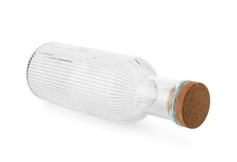Empty clear glass bottle with cork stopper lying horizontally on white backgr Stock Photos