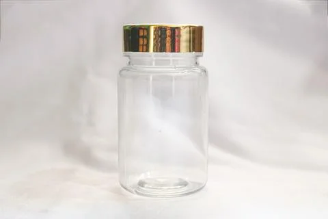 Empty Clear Plastic Bottle with Luxurious Gold Cap for Product Packaging Stock Photos