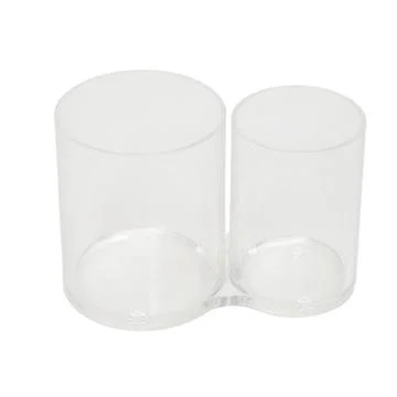 Empty clear plastic double makeup brush holder on white background. Transpa.. Stock Photos