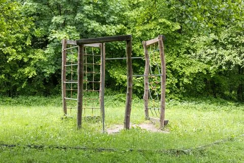 Empty climbing structure in a forest clearing Foto stock