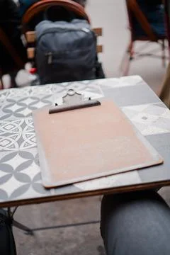 Empty Clip Board Lying on a Table with Patterns Stock Photos