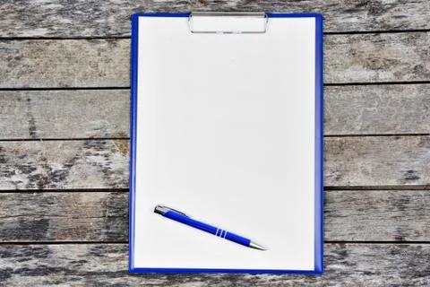 Empty clipboard with pen on table Stock Photos