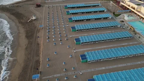 Empty closed blue beach resort. No people for covid-19 lockdown. Stock Footage 152501667