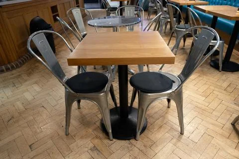 An Empty Closed Cafe with Dining Seats and Table Stock Photos