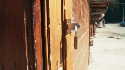 Empty closed shops. Lock on window. Shot on RED Raven Video stock 105746207