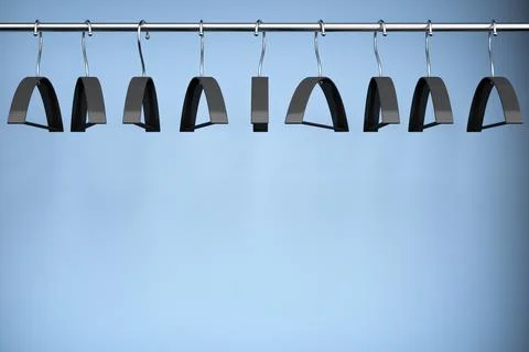 Empty clothes hangers. Copy space. Stock Photos
