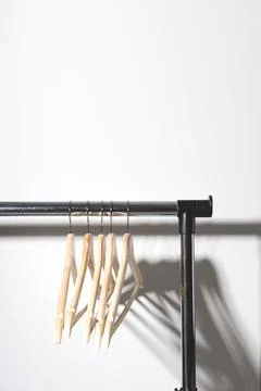 Empty clothes hangers on plain. Conscious consumption slow fashion concept Stock Photos