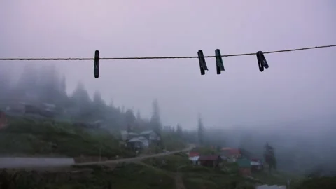Empty clothesline with clothespins in the village Stock Footage 297963116