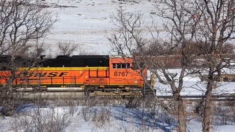 Empty coal train enters scene left, pan with engine, exits scene right Stock Footage 105190991