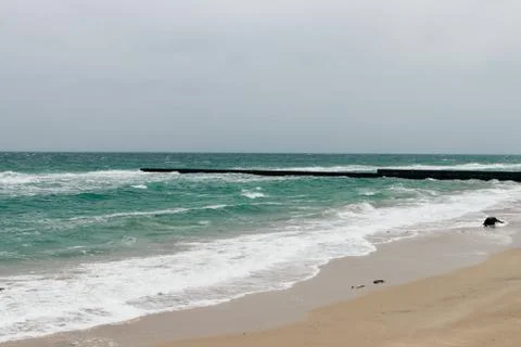 Empty coast with a pier Stock Photos