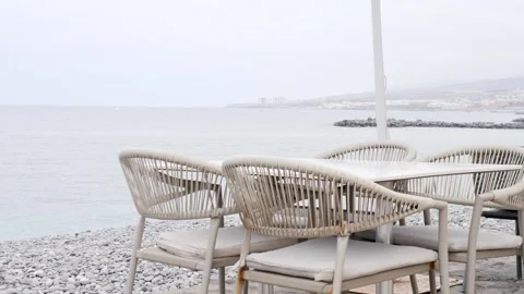 An Empty Coastal Dining Area Featuring a Scenic View of the Ocean Stock Footage 316666576