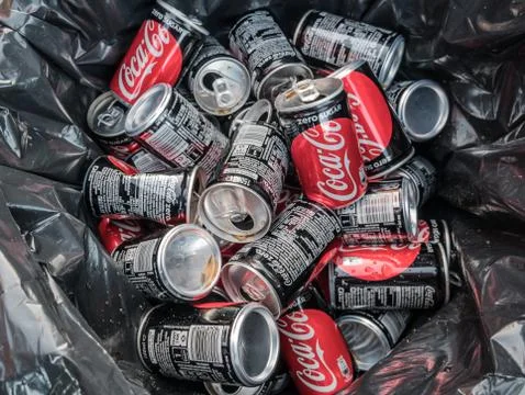Empty Coca Cola boxes in the trash Stock Photos