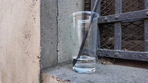 Empty cocktail glass with straw Stock Footage 322799057
