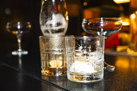Empty Cocktail Glasses After Drinks at Bar Stock Photos