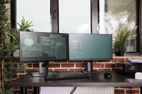 Empty coding room with multiple monitors on desk, Stock Photos