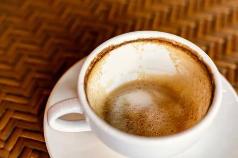 Empty coffee cup after drink on wood table. Stock Photos