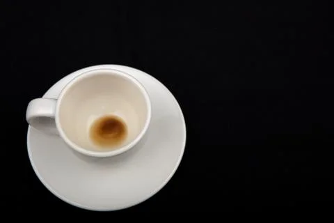 Empty coffee cup on black background Stock Photos
