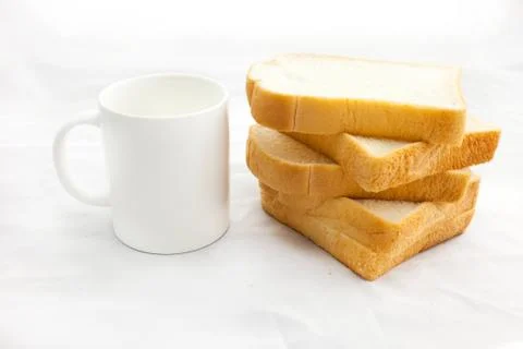 Empty coffee cup or coffee mug and sliced bread isolated on whit Stock Photos