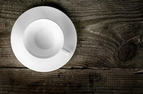 Empty coffee cup on wooden table Stock Photos