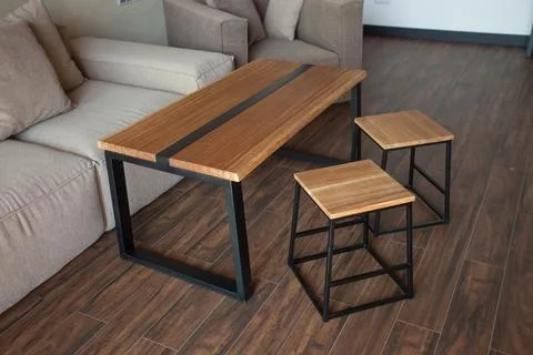 Empty coffee table over defocused coffee shop background with copy space Stock Photos