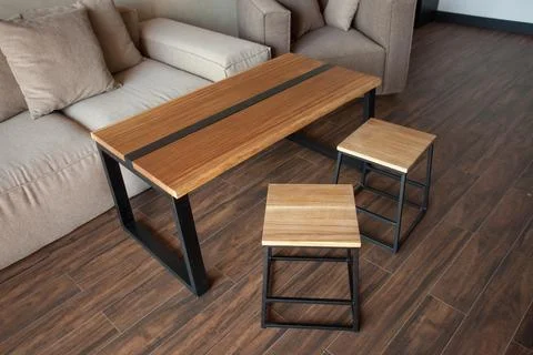 Empty coffee table over defocused coffee shop background with copy space Stock Photos