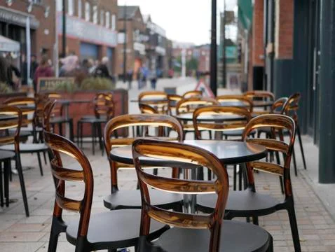 Empty coffee terrace with tables and chairs Stock Photos